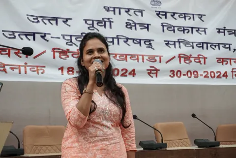 NEC employee participating in the Hindi music competition or