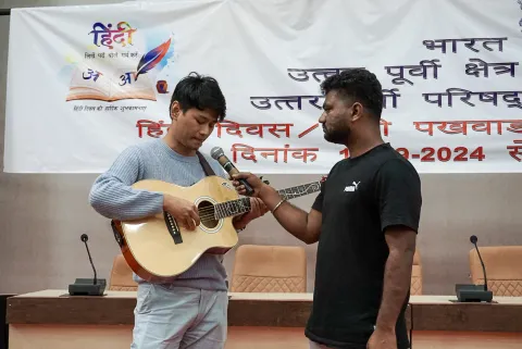 NEC employee participating in the Hindi music competition