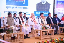 Home Minister, Sh. Amit Shah sitting on the dais along with
